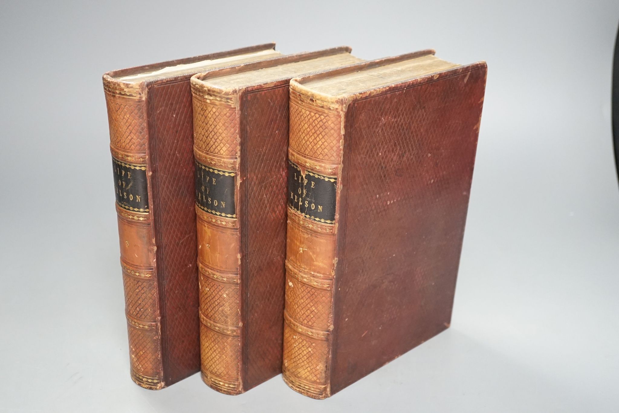 Clarke, Rev. James Stainer and M'Arthur, John - The Life and Services of Horatio Viscount Nelson ... (new edition), 3 vols, engraved pictorial and printed titles, 35 plates (but lacks Boulogne plan); contemp. diced calf,